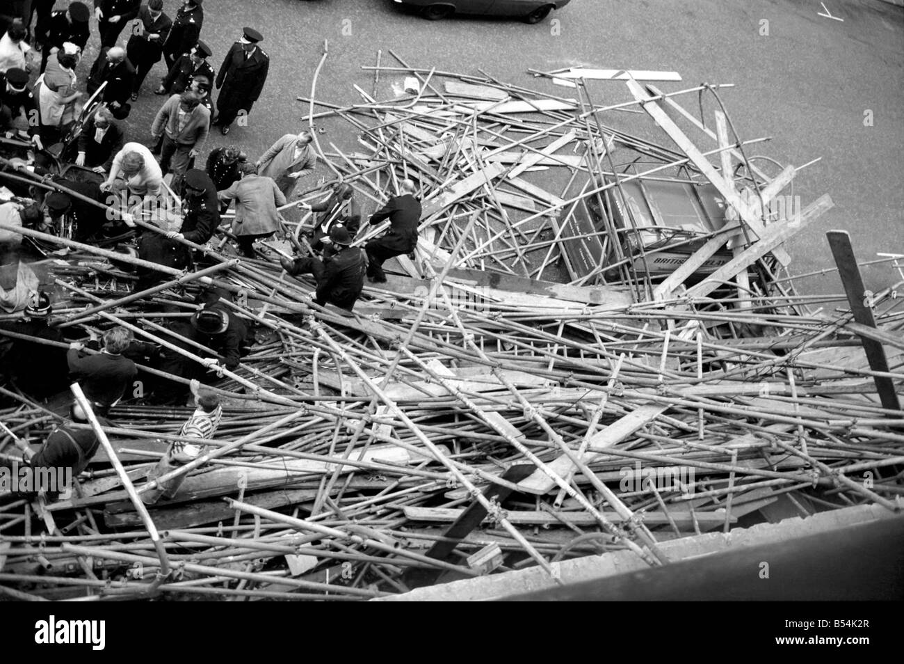 Police and fireman swarm at the scene where a 100ft framework of Scaffolding collapsed on to a Daimler limousine, killing Sir David Rose, Governor General of Guyana. ;November 1969 ;Z10837-001 Stock Photo
