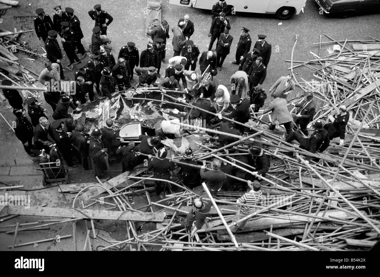 Police And Fireman Swarm At The Scene Where A 100ft Framework Of 