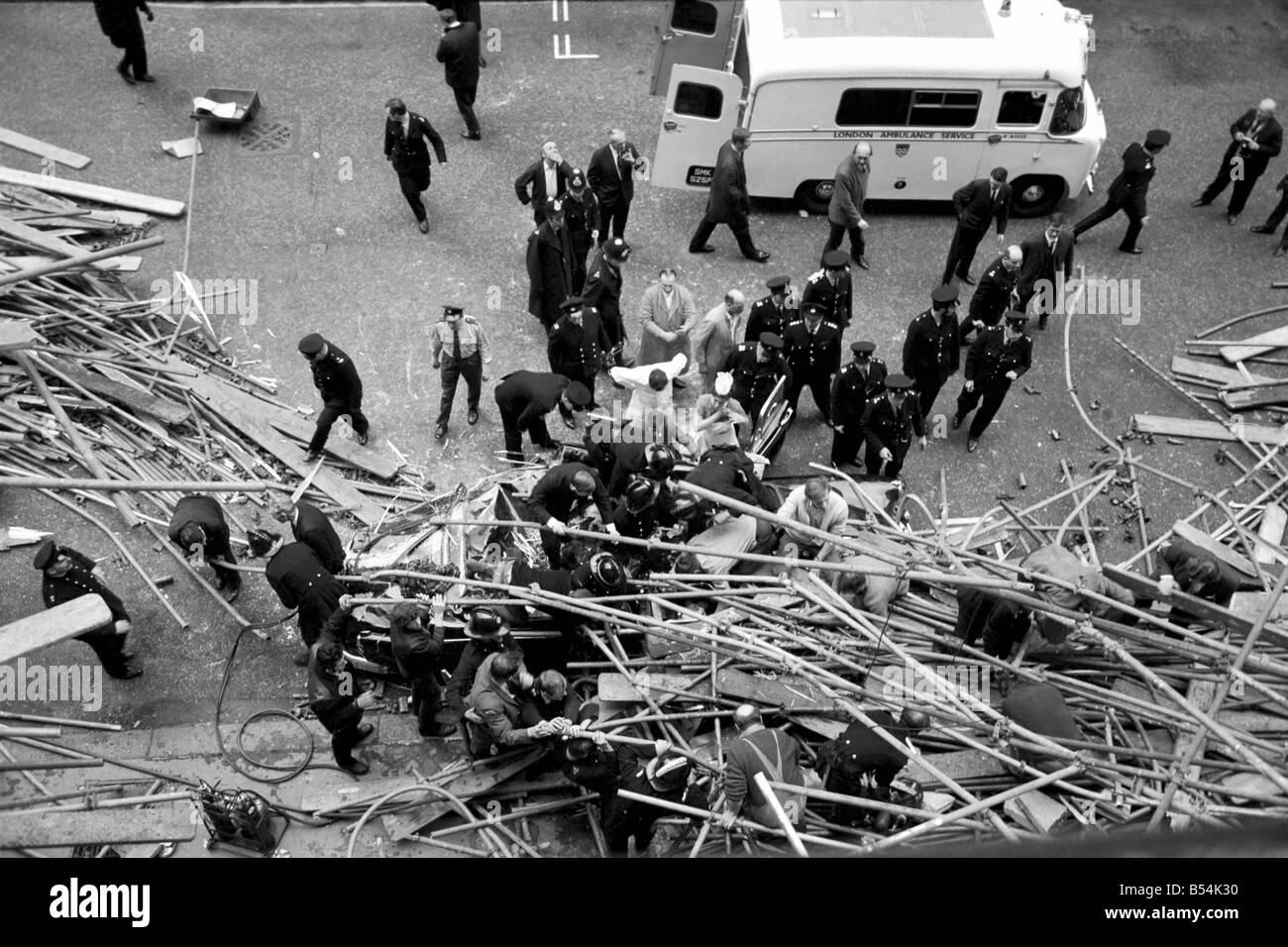 Police and fireman swarm at the scene where a 100ft framework of ...