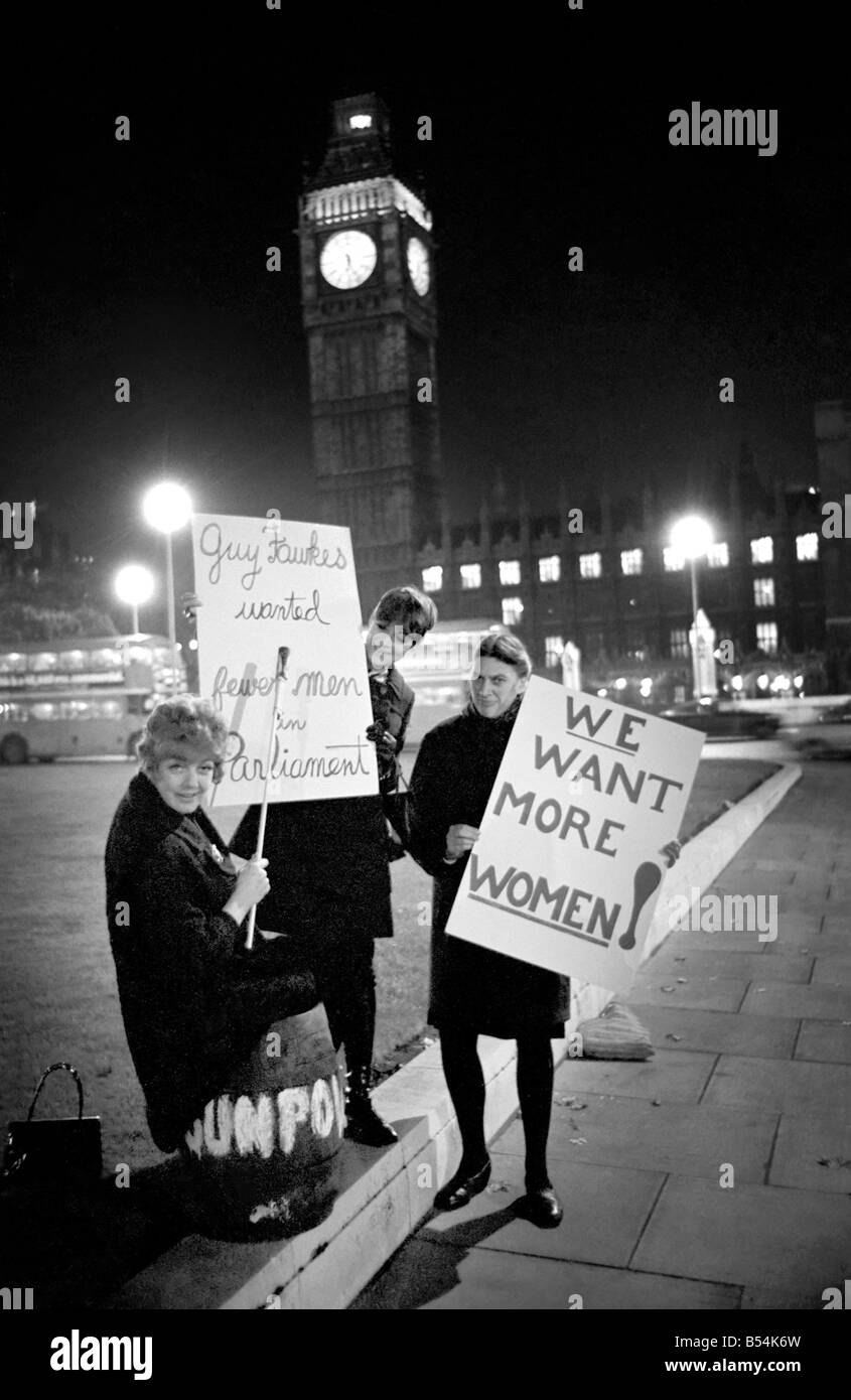 Actress Diane Heart and members of her pressure group for women in Parliament staged a guy fawkes demonstration outside the house of commons. Miss Heart who is starring in 'The Man Most Likeley to' at the Vaudeville theatre arrived in parliament square with a barrel full of beer and marked 'Gunpowder'. After the demonstration actress Diane went straight of the theatre to play her part. L to R. Diane Heart, Actress Erika Brand and playwrite, Mrs Irene Coates. November 1969 Z10693-002 Stock Photo
