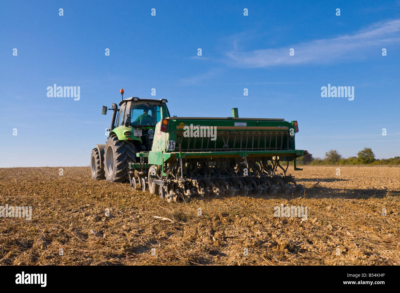 'Deutz-Fahr' tractor towing 'Great Plains' combined harrow and seed drill - sowing Winter Wheat, Indre-et-Loire, France. Stock Photo