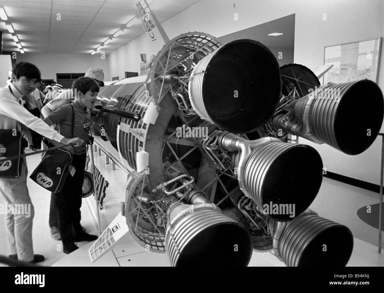 Visitors at NASA Space Station in Florida, U.S.A a few hours before Apollo 12 blasted off on a mission to the moon. Looking at Stock Photo