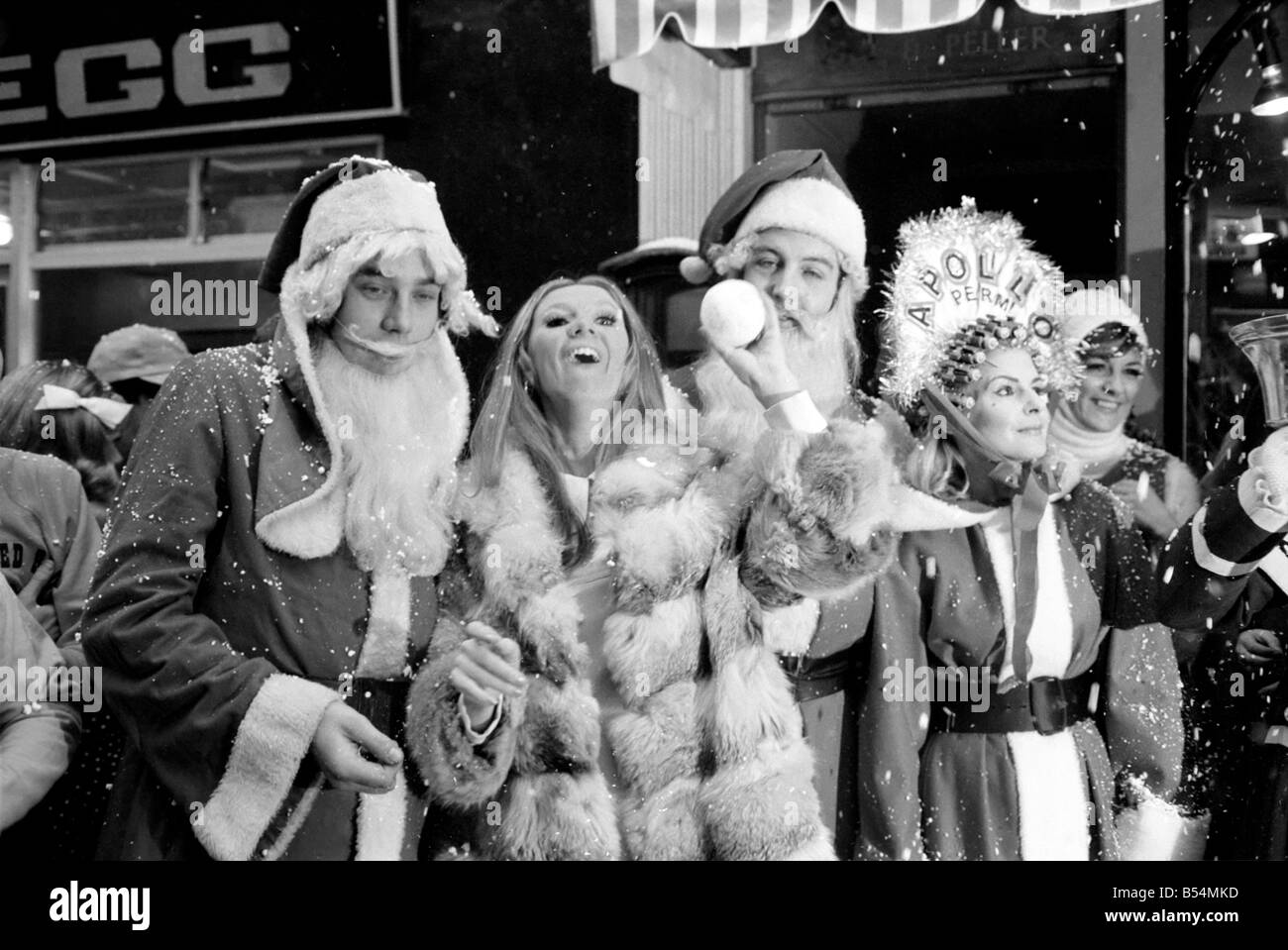 Festive Scenes. In South Molton street, Mayfair , it was snowing but it was only plastic snow that was falling. Singer Clodagh Rogers was present with Father and Mother Christmas, to open the street's Christmas display of lights. Clodagh Rogers with snowballs with Mother and Father Christmas. December 1969 Z11515-005 Stock Photo