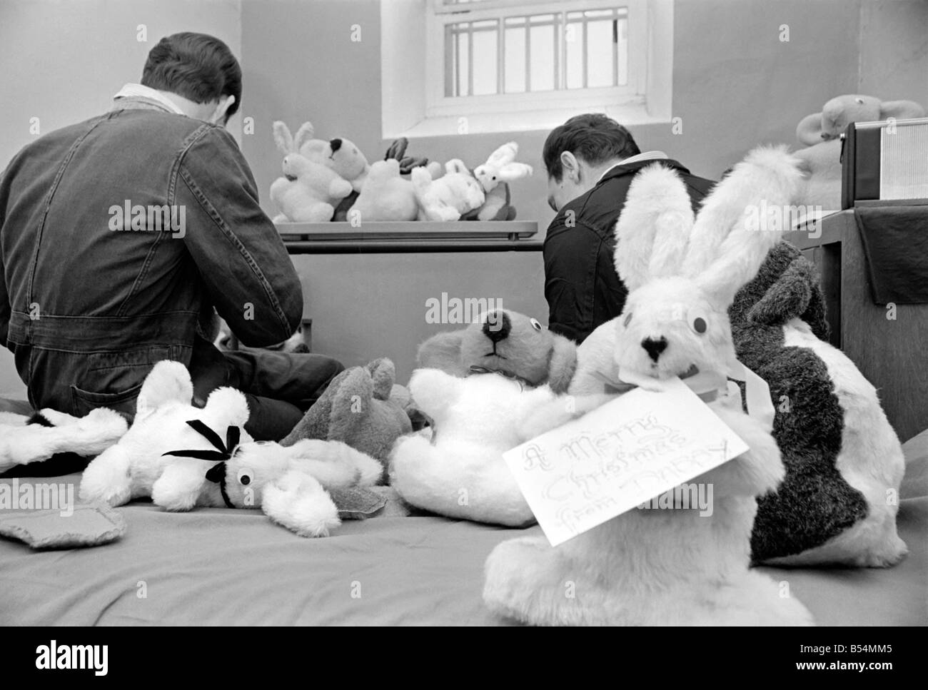 Prisoners inside their cells at Dartmoor Prison making soft toys for local childrens charities