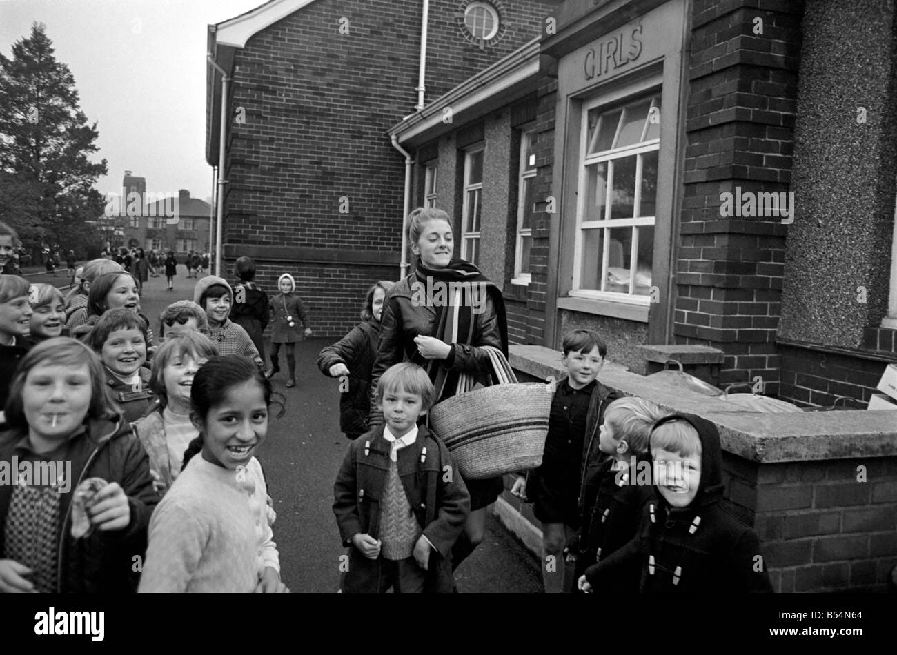 Clitheroe School Strike. Teacher Miss Kianne Kay surrounded by pupils