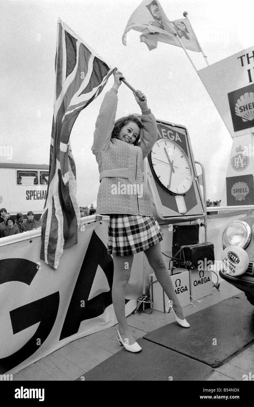 R.A.C. Rally: Miss U.K. Sheena Drummond, Waves the flag for the start of the R.A.C. Rally. November 1969 Z11051-004 Stock Photo