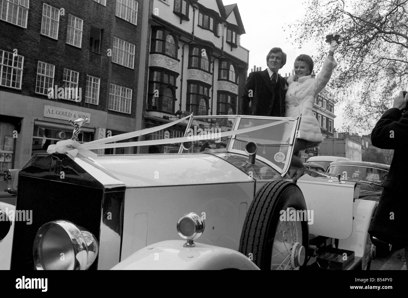 Actess and top model Vicki Hodge today married Ian Heath ,who is in advertising, at Chelsea Register Office. The bride wore a white mini dress and coat, and the couple drove off after the ceremony to a small lunch reception in a white 1923 Rolls Royce. The couple, Vicki and Ian pictured in the 1923 white Rolls Royce after the ceremony. December 1969 Z11599-006 Stock Photo