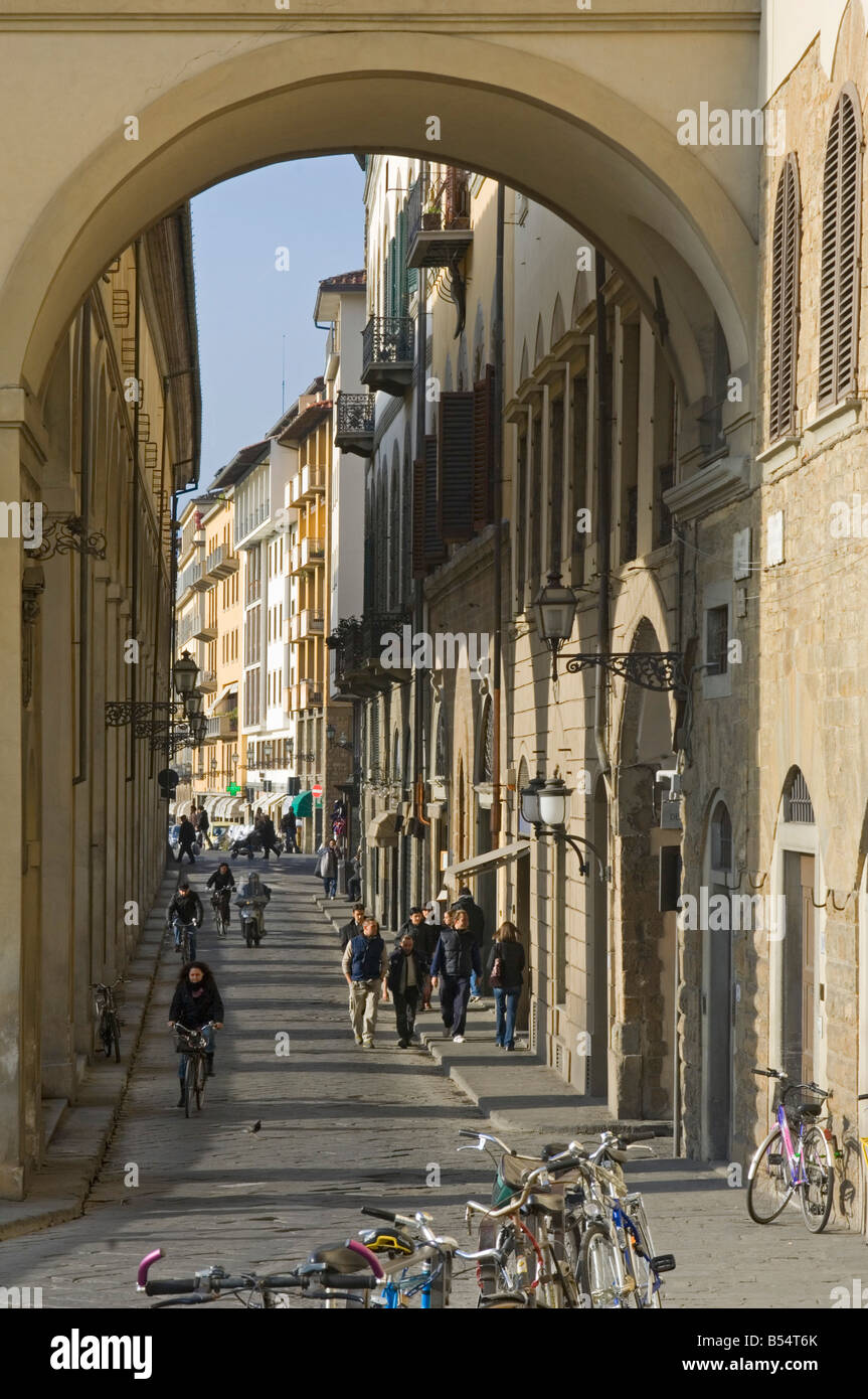 A view along Lungarno General Diaz leading to the Ponte Vecchio Bridge with the Vasari corridor above the arches on the left. Stock Photo
