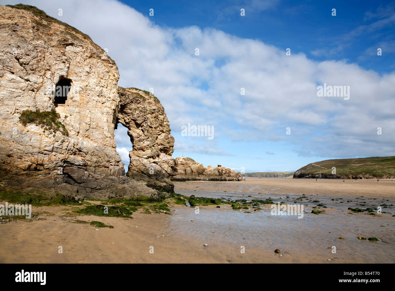 Natural stone arch and cave window in Perranporth Cornwall UK. Stock Photo