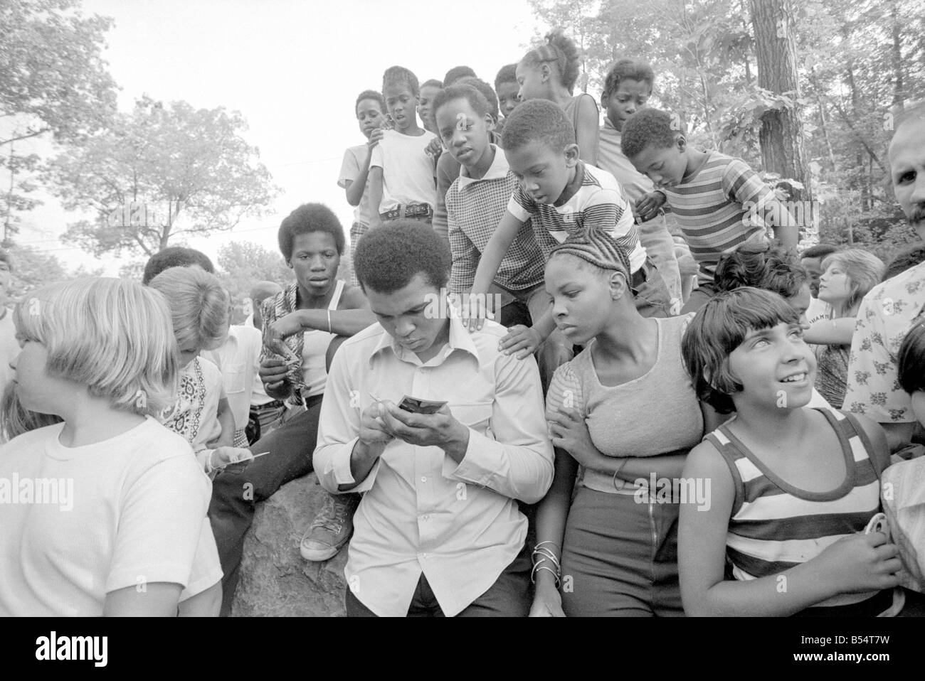 Muhammad Ali Cassius Clay training at his Pennsylvanian mountain retreat for his fight against George Foreman in Zaire With family friends and fans August 27th 1974 27 08 1974 74 5147 Local Caption mohamed Stock Photo