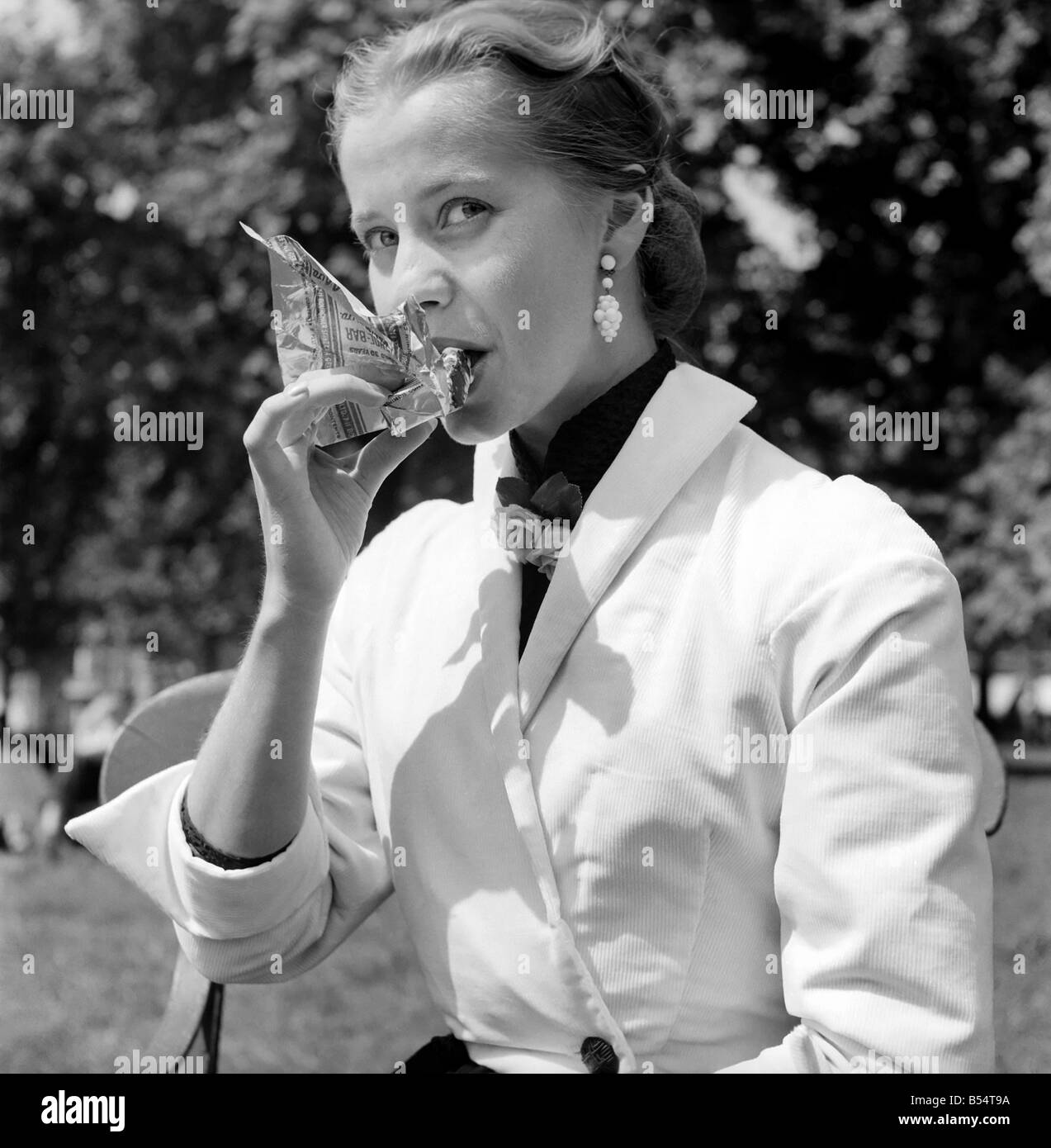 Eating for woman Black and White Stock Photos & Images - Alamy
