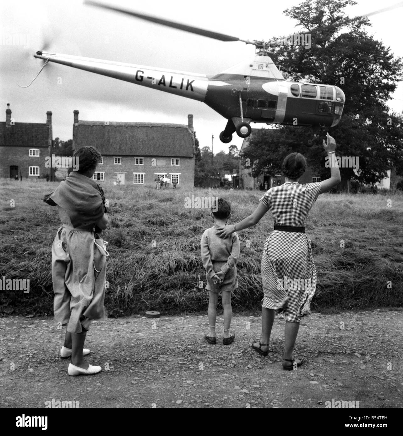 Westland Helicopters at Yeovil in Somerset built the Westland- Sikorsky W.S.51 under licence from the American company Sikorsky. ;It was one of the more successful early helicopters. ;When production ceased in 1953 around 139 had been built. ;Picture landing on the village green at Nether Compton in Devon, being greeted by the local children August 1969.;D5309 Stock Photo