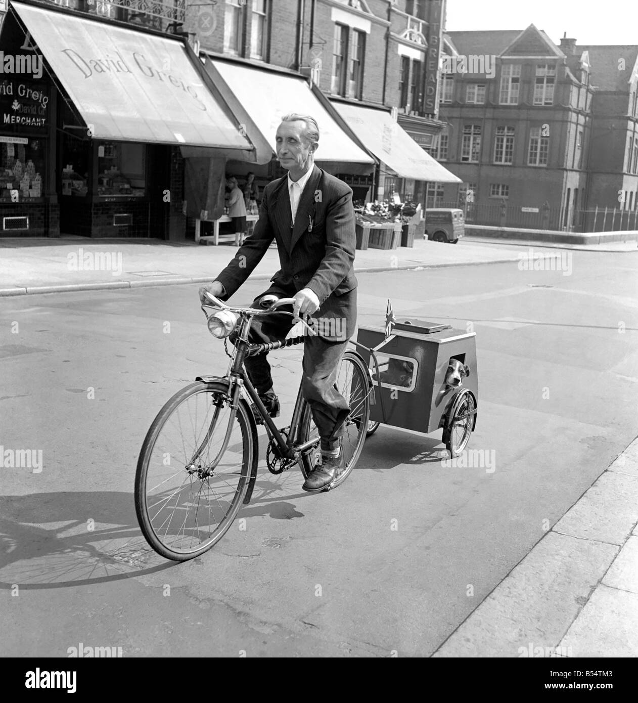 Animals: Dog: Humour: And here is the dog caravan, made by Mr. C. Tumbridge, of Chamberlain Road, Rensal Rise, H.W. 10. who is paddling his dog Prince, 7 year old, for a doggie caravan ride. September 1969 D5537-001 Stock Photo