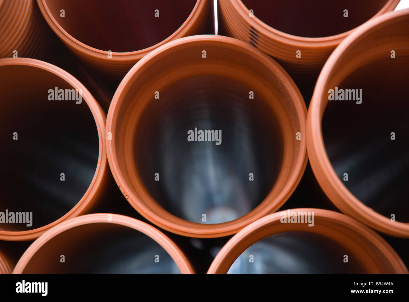 Plastic pipes in builders yard Stock Photo Alamy