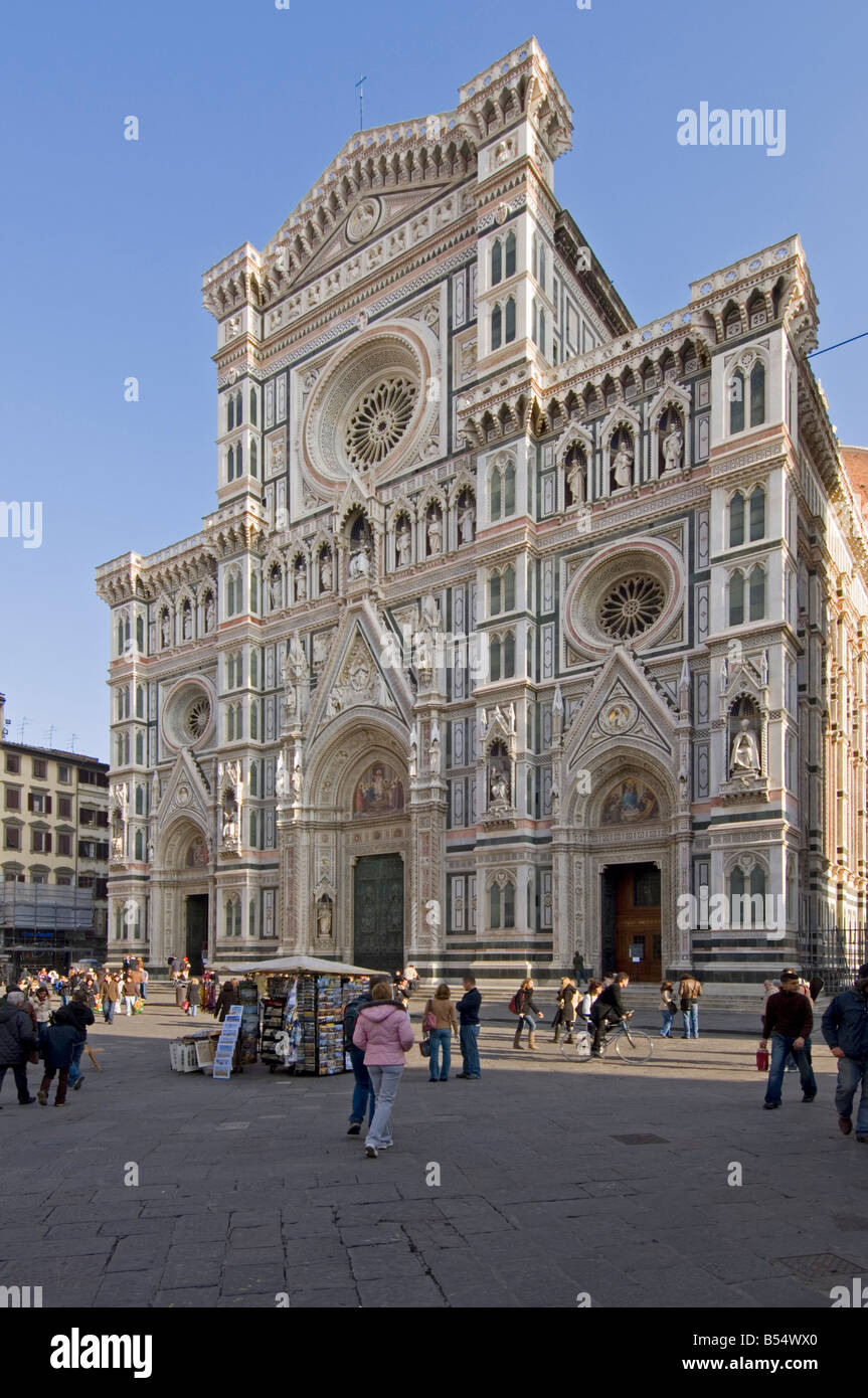 A view of the Basilica di Santa Maria del Fiore (Duomo) facade with tourists in the Piazza Del Duomo in Florence. Stock Photo