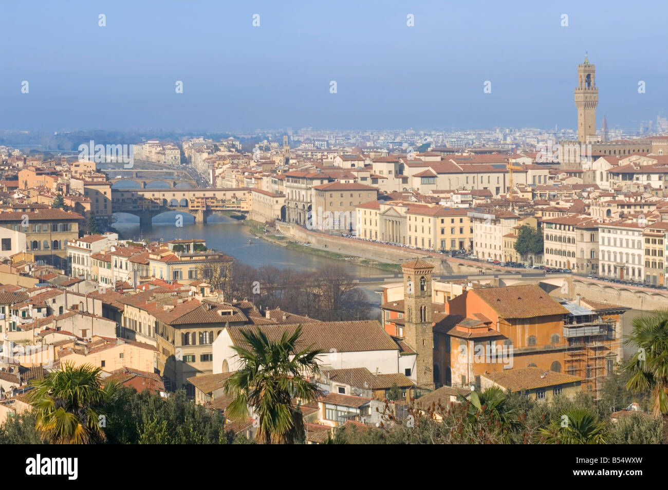A wide cityscape view of Florence - NB Ponte Vecchio bridge and the Palazzo Vecchio tower. Stock Photo