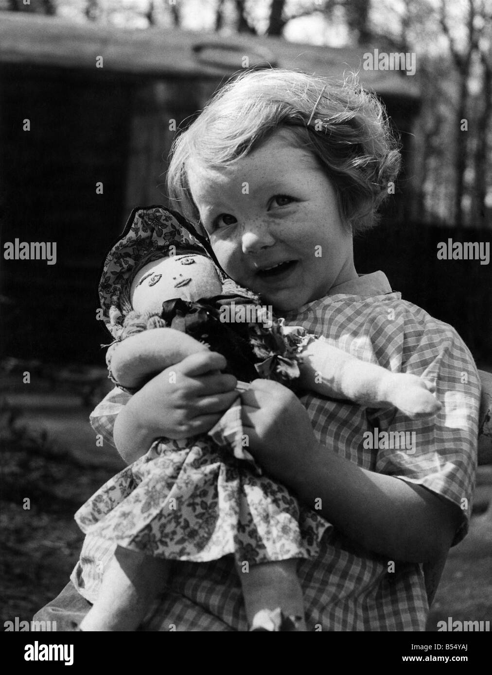 1950s girl with toy doll hi-res stock photography and images - Alamy