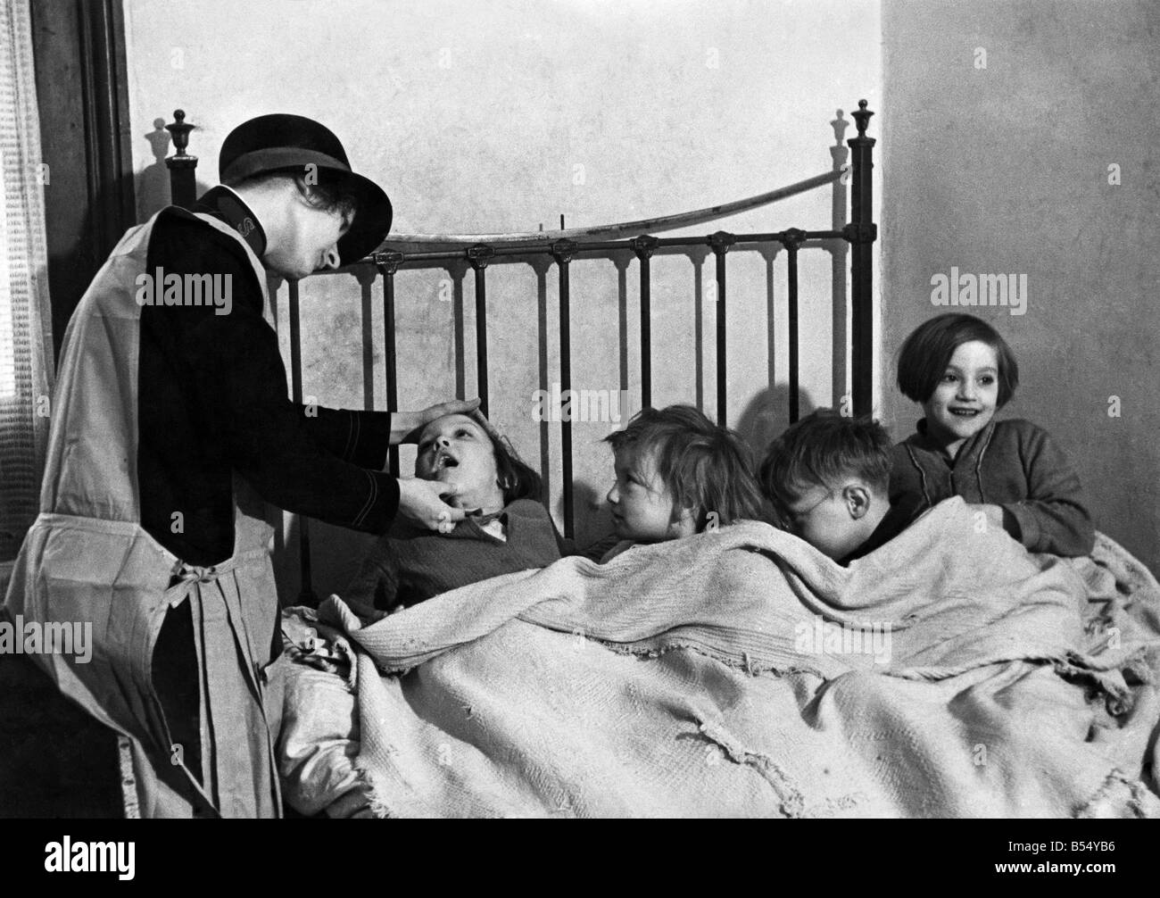 Children tucked up in bed at a Salvation Army place. July 1935 P012170 Stock Photo Alamy