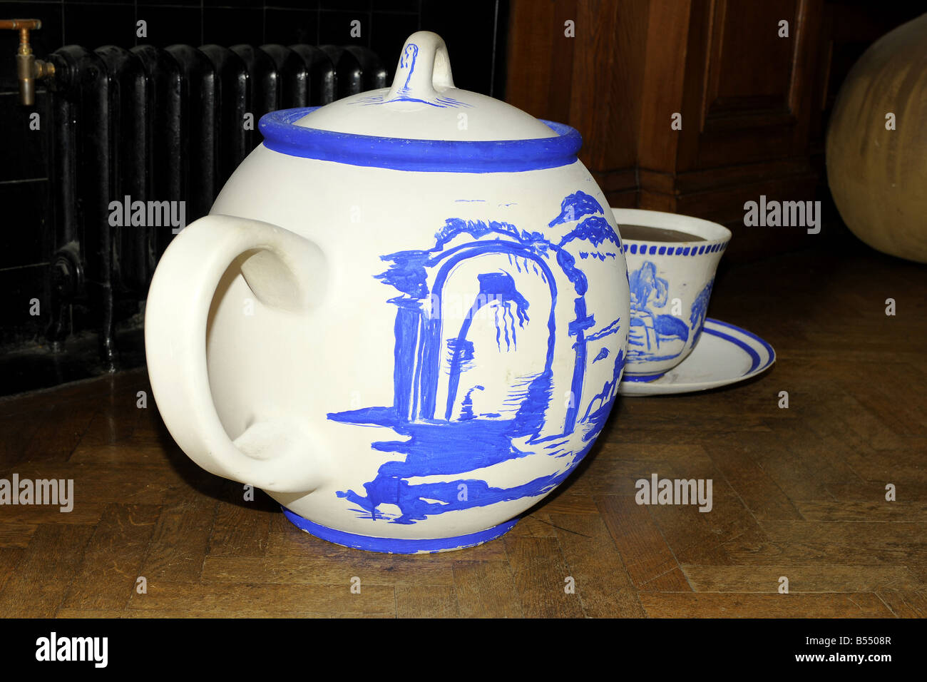 Giant Teapot and cup and saucer used on the Alice in Wonderland film seen at the London Movie Museum Stock Photo