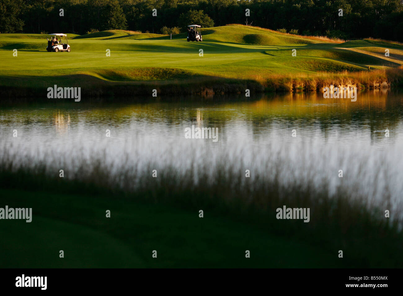 A golfer plays a hole on the Les Bordes golf course located in the