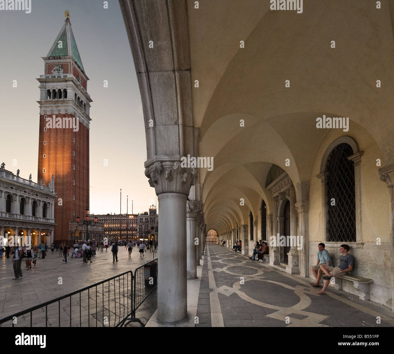 The Campanile at dusk from the arcade around the Palazzo Ducale, Piazzeta, San Marco, Venice, Veneto, Italy Stock Photo
