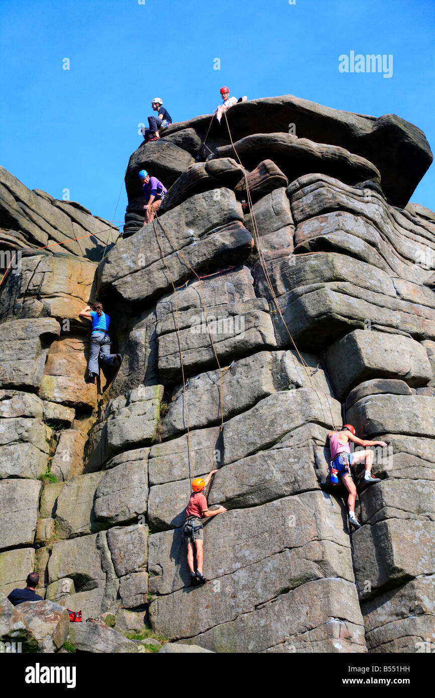 Rock climbers on Stanage Edge Hathersage Derbyshire England UK Stock