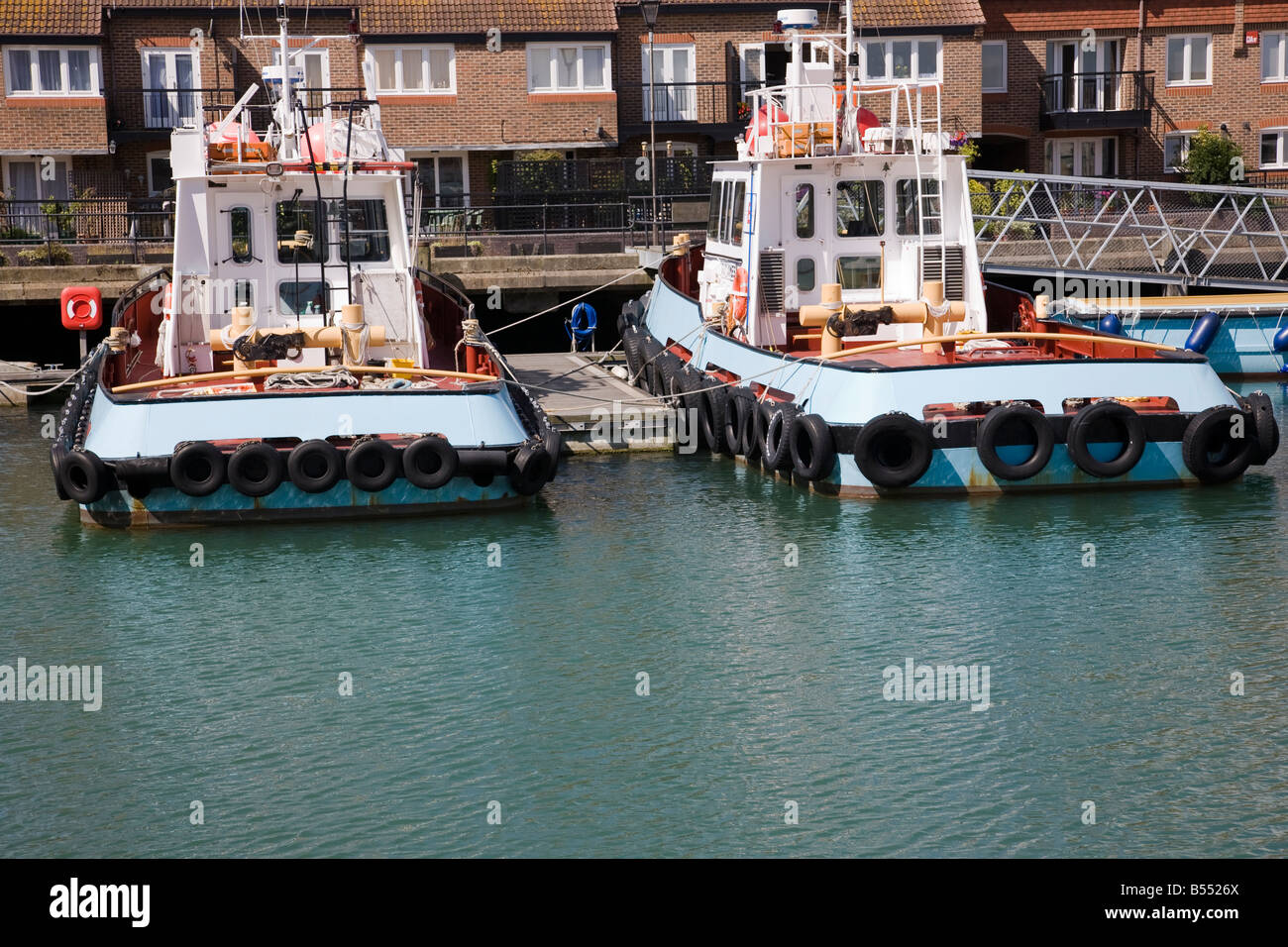 Two tug boats moored in Camber Dock, Portsmouth, Hampshire, England. Stock Photo