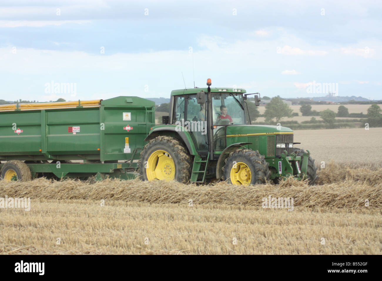 Harvest hay tractor hi-res stock photography and images - Alamy