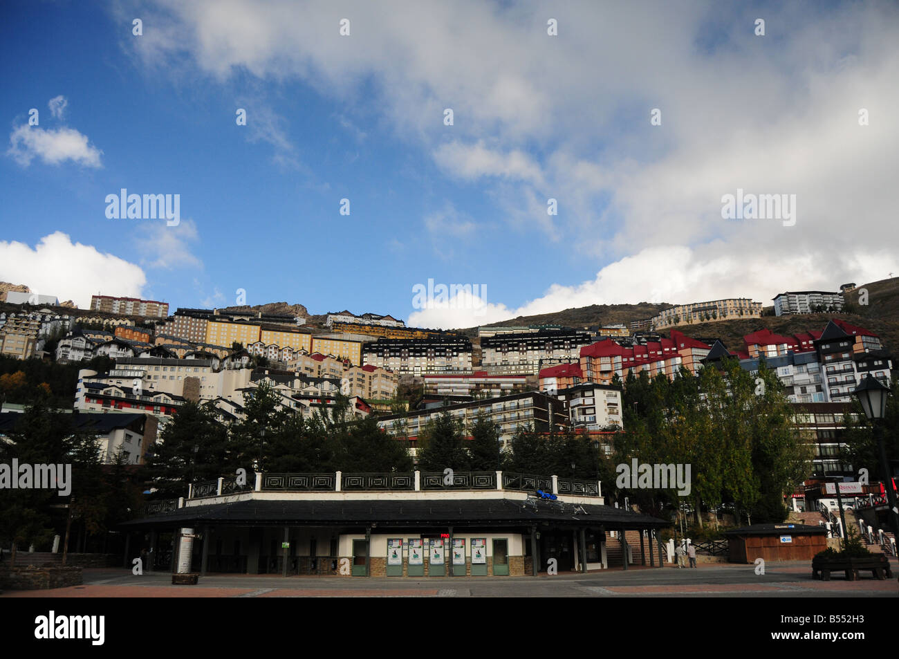 Ski Resort of Sierra Nevada, Andalusia, Spain in Summer (out of ski-season). Hotels, chalets and lodges rising above the square. Stock Photo