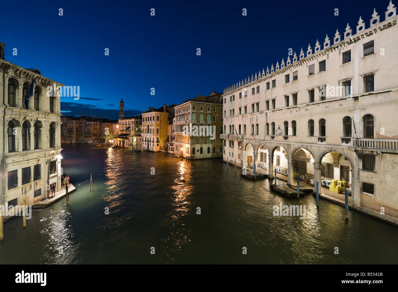 View of the Grand Canal from the Rialto Bridge at night with the main Post Office to the right ,Venice, Veneto, Italy Stock Photo