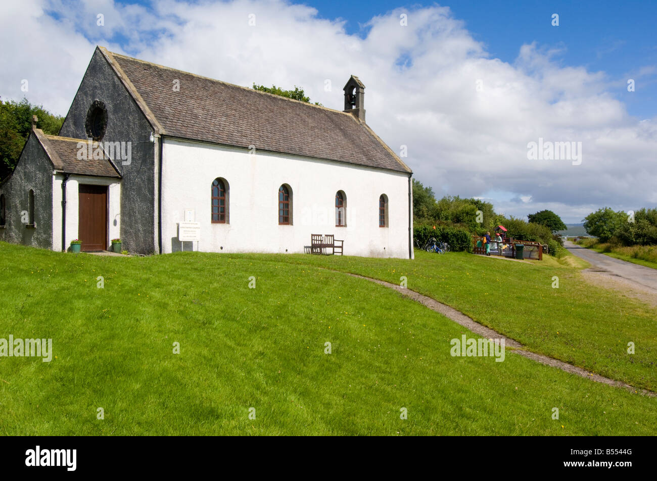 Jura Parish church at Craighouse village, a Church of Scotland kirk built in 1777, looking north across Small Isles Bay Stock Photo