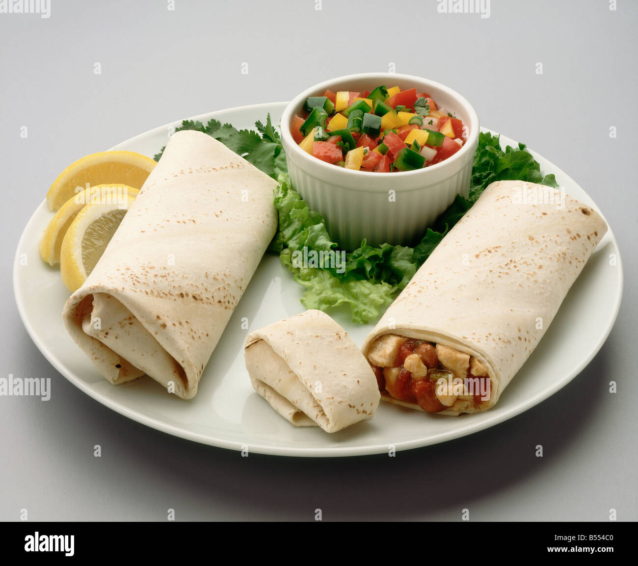 Chicken burrito with salsa Stock Photo - Alamy