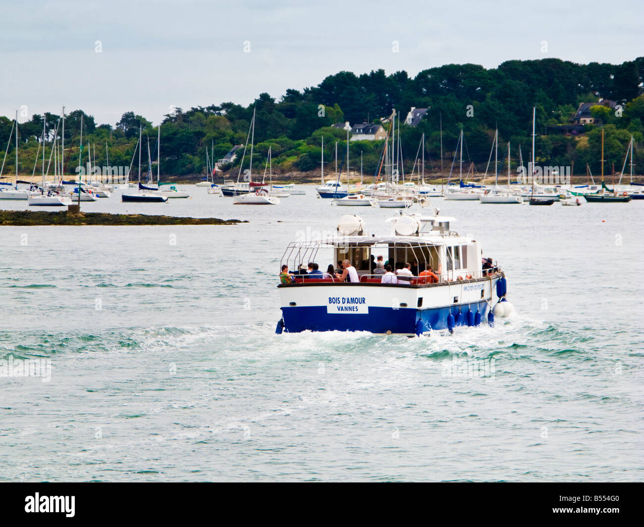 Small passenger ferry across the Gulf of Morbihan from Port Blanc to the Ile aux Moines Brittany France Europe Stock Photo