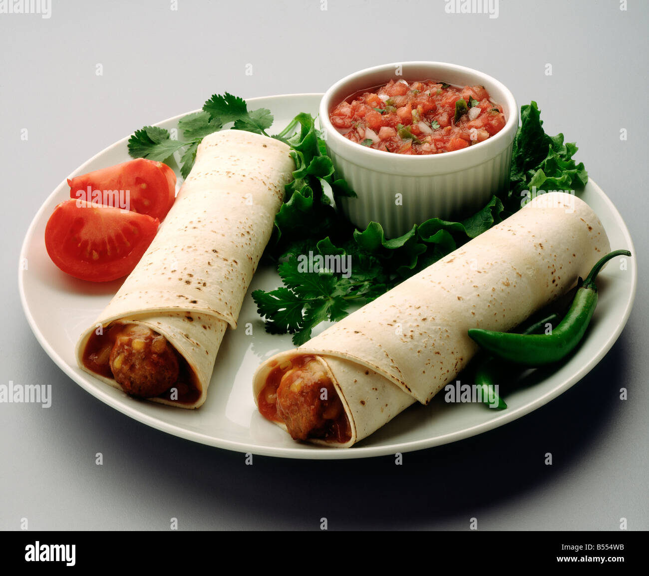 Mexican sausage burritos with salsa and fresh tomatoes Stock Photo Alamy