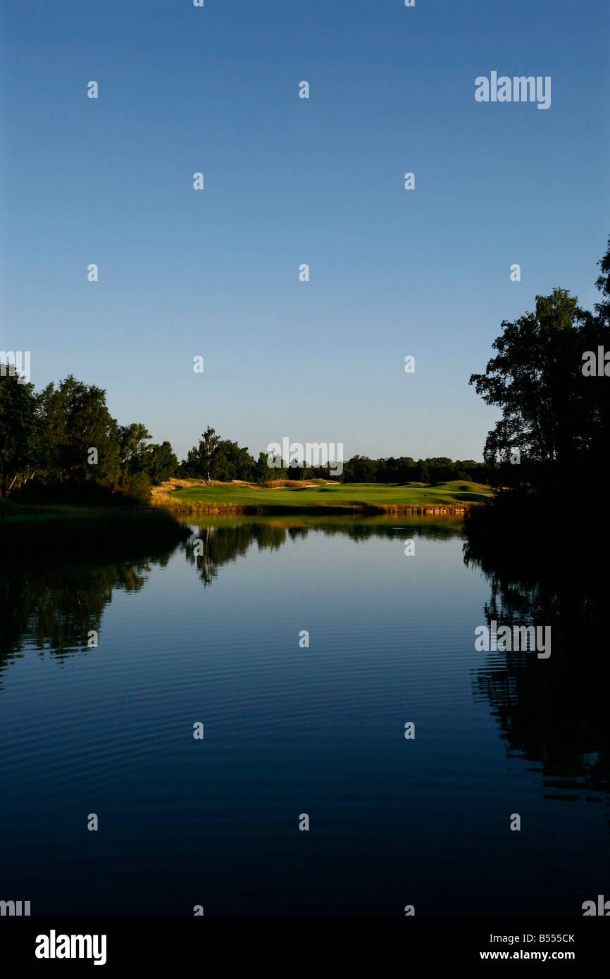 A golfer plays a hole on the Les Bordes golf course located in the