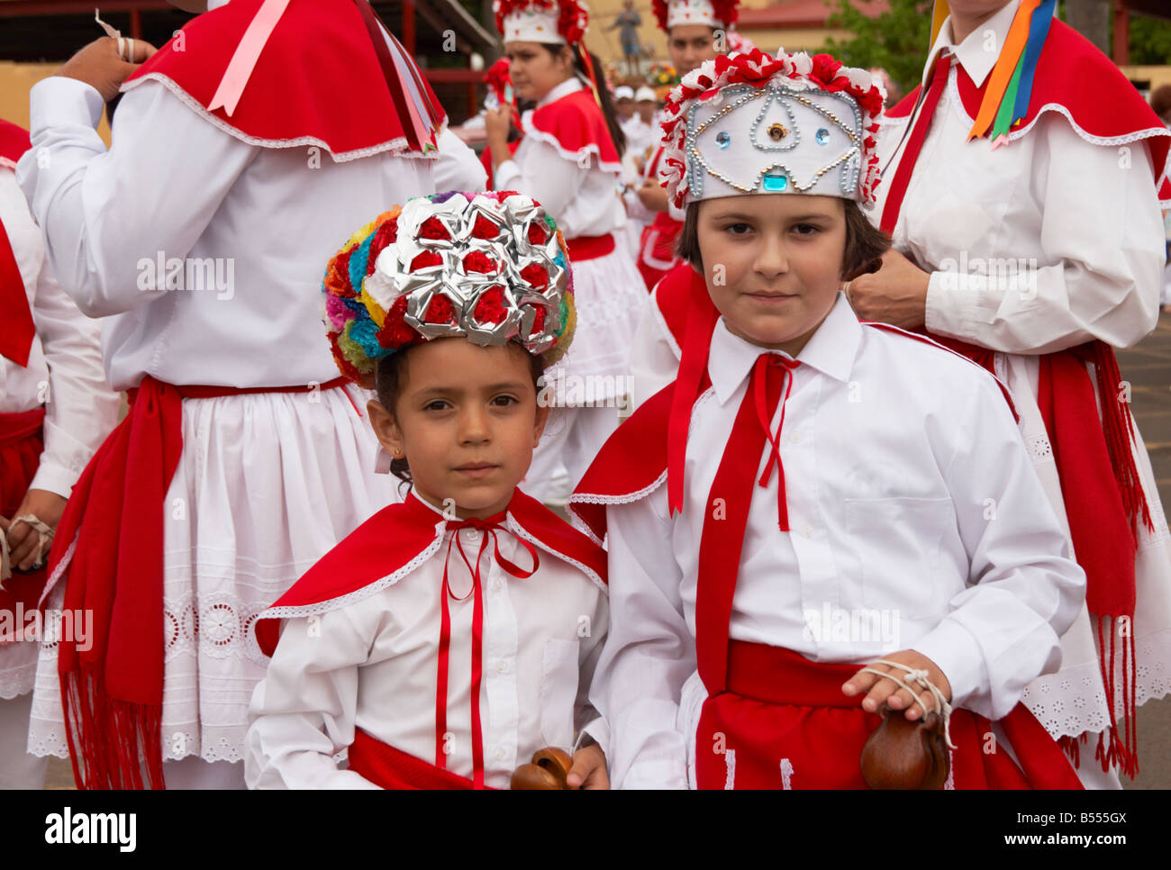 Girls from El Hierro island in the Canary islands in Los Bailarines (dancers) traditional red and white costume at local fiesta Stock Photo