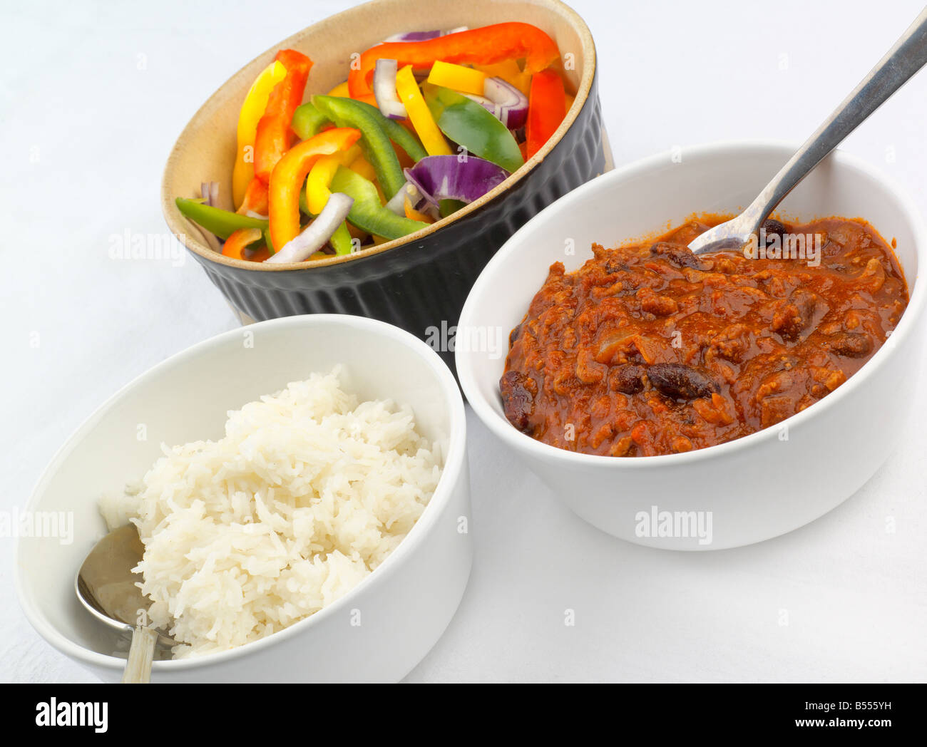 Chilli con carne with rice and bell peppers Stock Photo Alamy