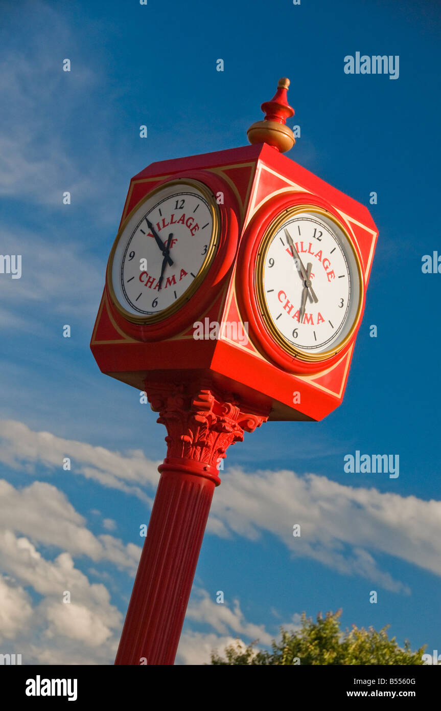 Old fashioned red cast iron clock tower at train station in Chama New