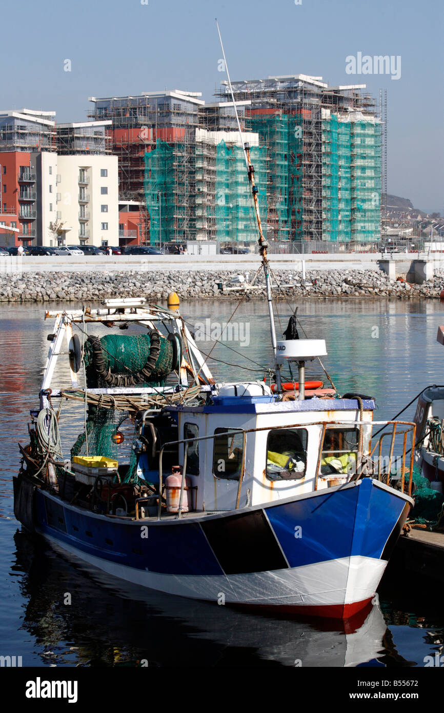 Fishing Boat in Swansea Harbour with new Waterfront Apartment