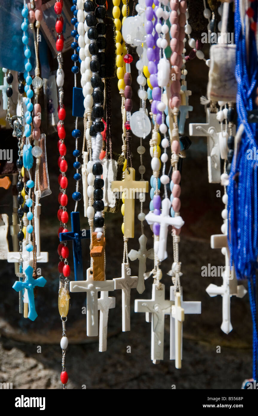 Selection of rosaries crosses and religious artifacts hanging at El Santuario de Chimayo Stock Photo