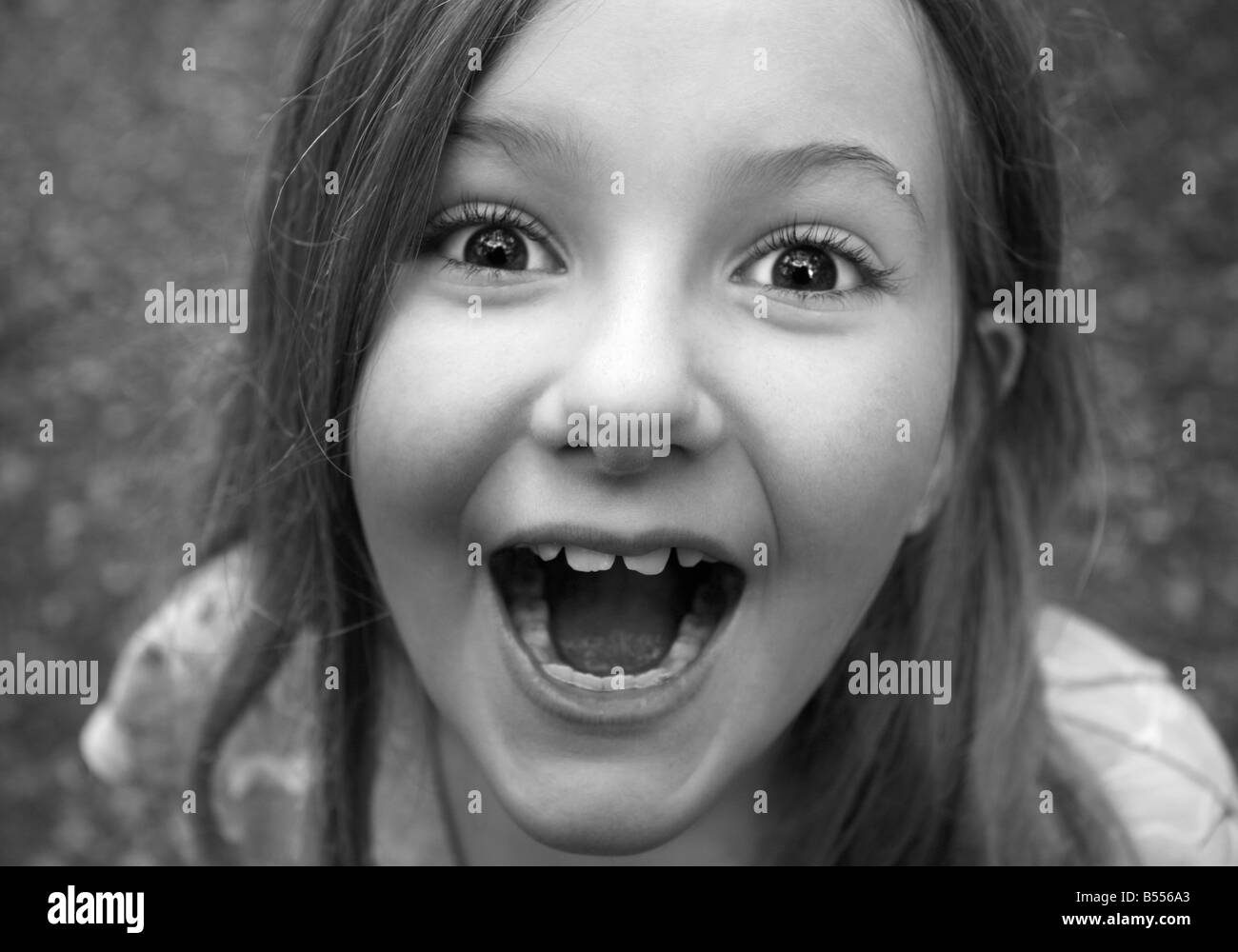 The face of an excited nine year old girl. Available in colour B5607R. Stock Photo