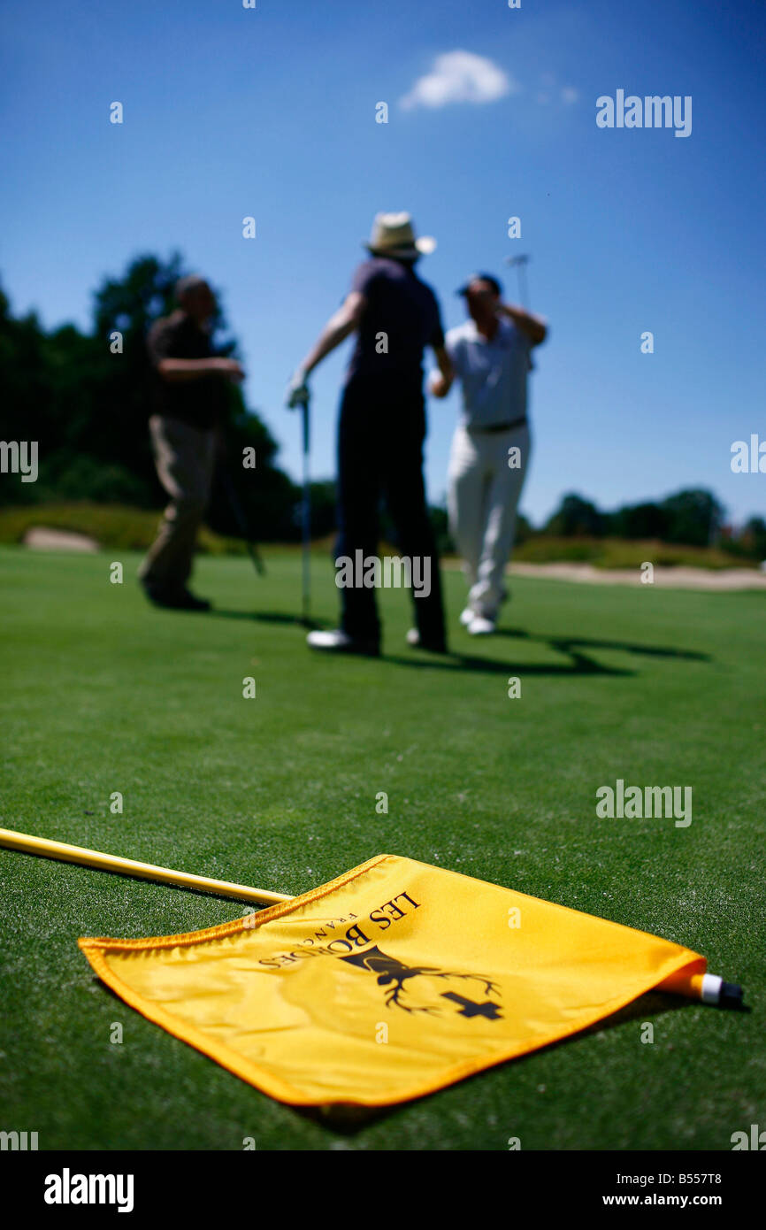 A golfer plays a hole on the Les Bordes golf course located in the