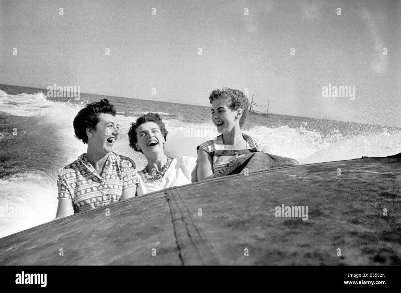 Three women Jane Christie of Finchley London , Veronica Collins of Chatham Kent and Judith Marsh of high Walstow Kent were bounced and soaked as each big wave drenched them whilst on a high speed boat ride on the sea at Brighton. August 1953 D5070 Stock Photo