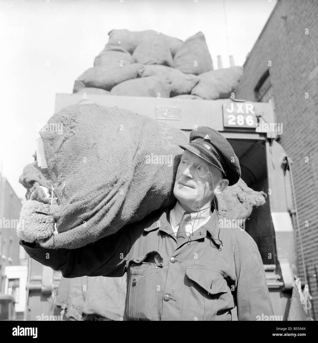 Dustman wears a monocle. August 1953 D5255-002 Stock Photo - Alamy