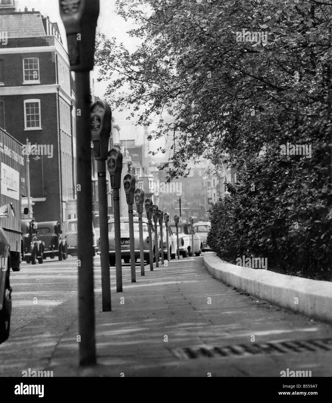 Parking Meters in Grosvenor Square, London. January 1965 P011349 Stock Photo