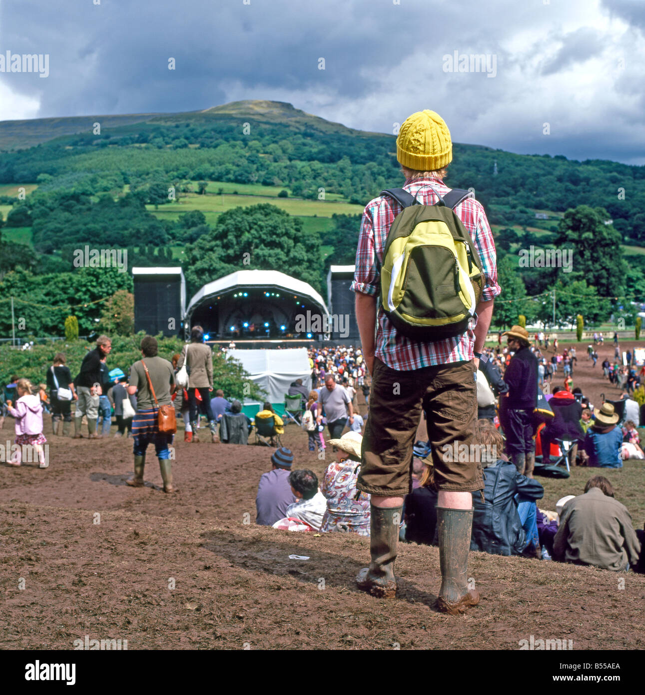 A view of a hippie man surveying the Green Man Festival site and stage near Crickhowell and Abergavenny in Mid Wales UK   KATHY DEWITT Stock Photo