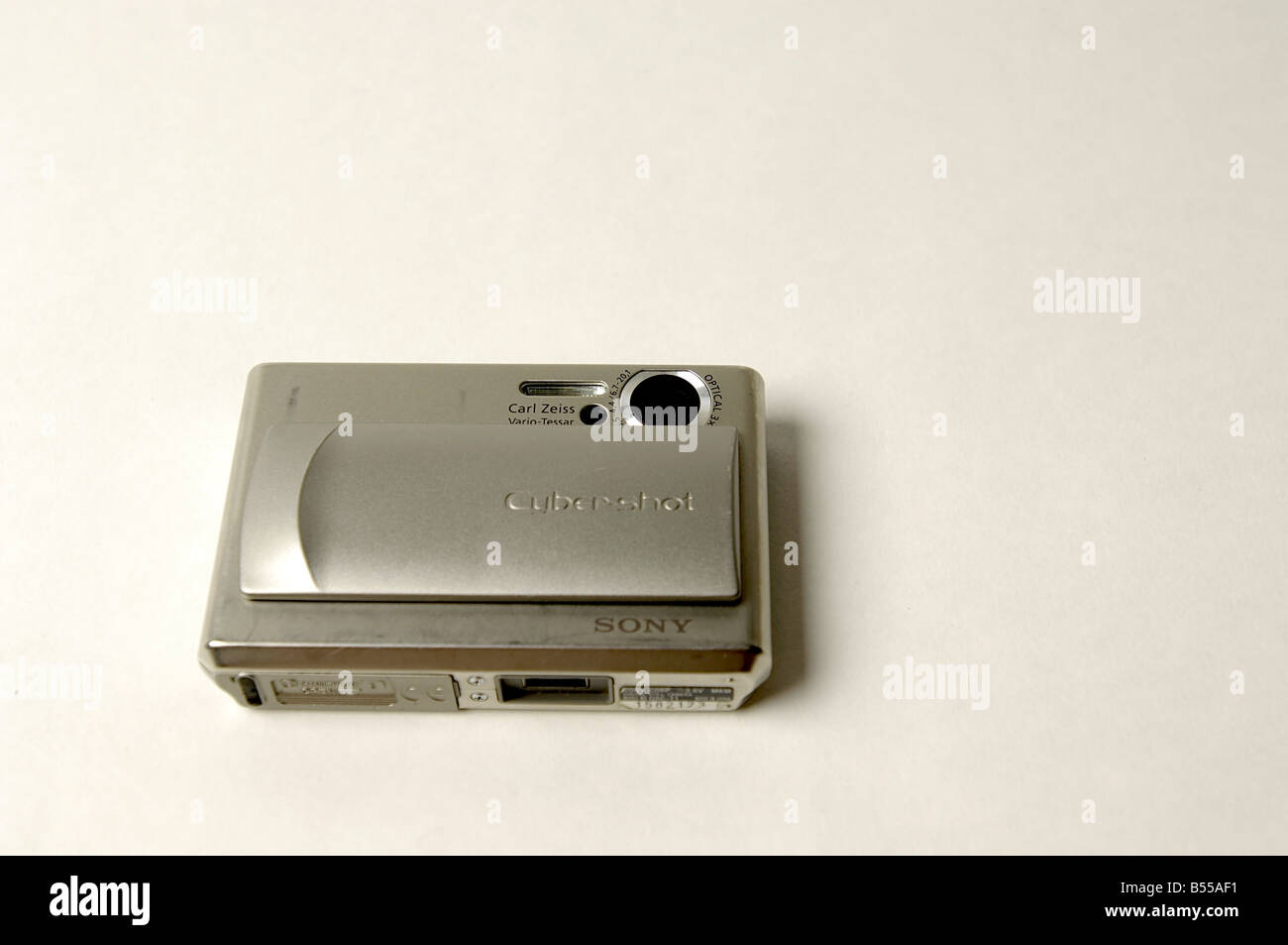 A well used cut out photo of a Sony 'DSC-T1' point and shoot consumer digital camera with Carl Zeiss lens Stock Photo