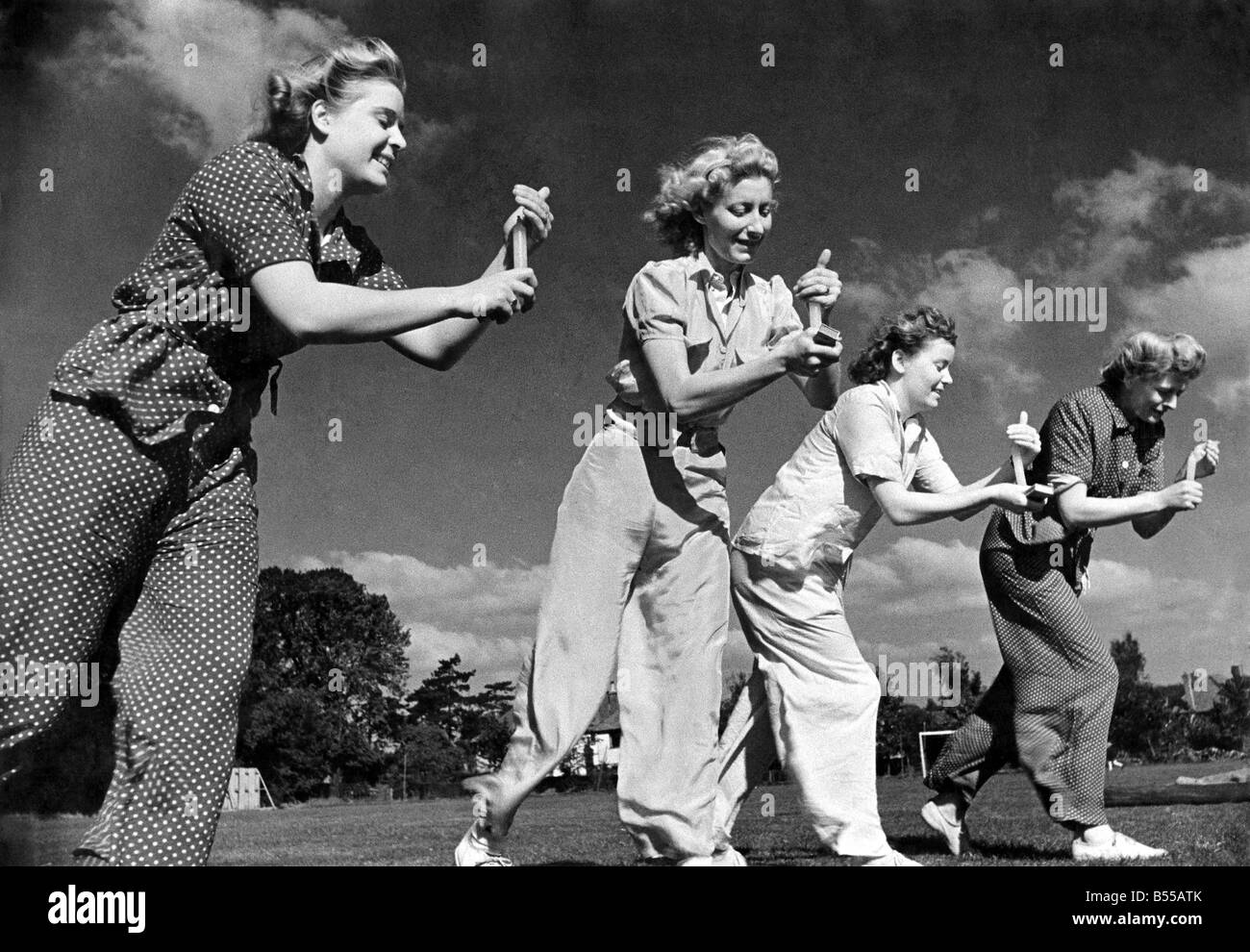 Food rationing means that the traditional egg and spoon race is banished from the village fete for the course of the war and replaced with the candle race.;At last they get going. Its worse than an egg and spoon race. For if the candle goes out it must be re-lighted before they can proceed. October 1944 P012219 Stock Photo