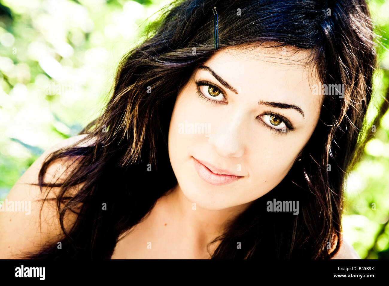 Beautiful woman with impressive green eyes staring at camera Stock Photo