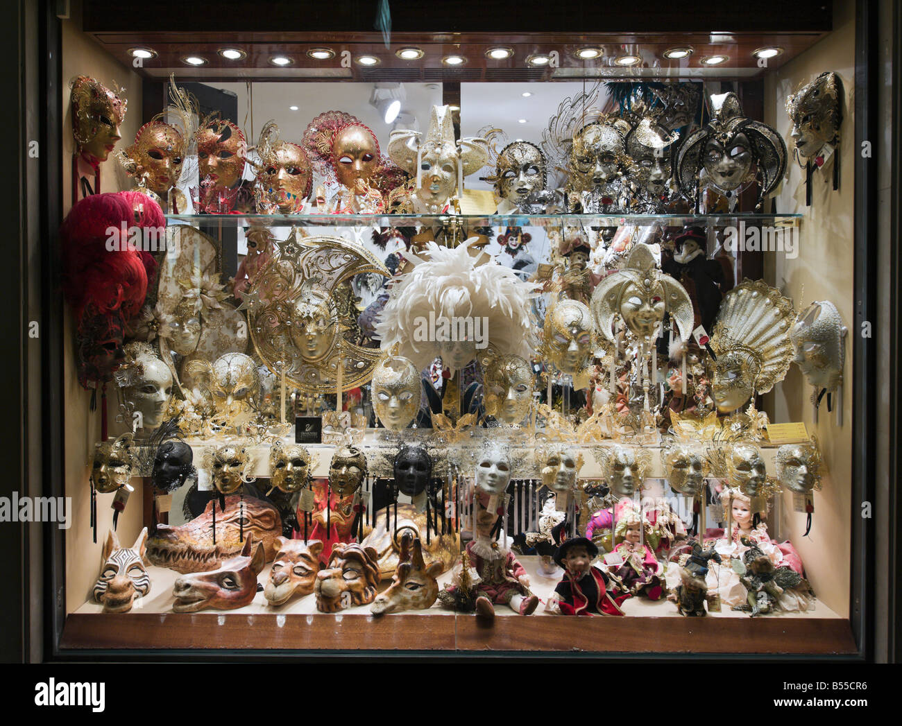 Carnival masks in a shop window at night, San Marco, Venice, Veneto, Italy Stock Photo